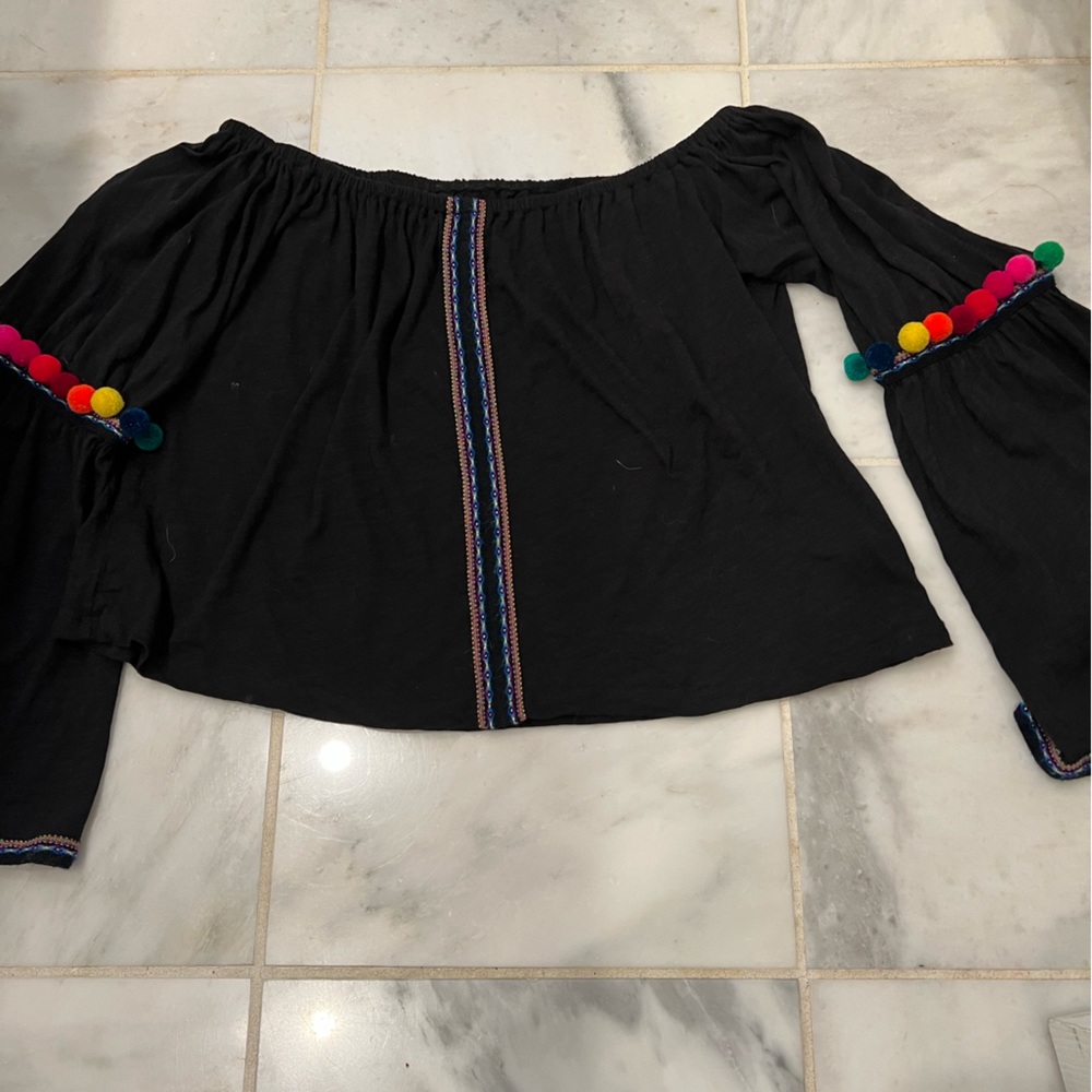 Off-the-shoulder top with fun pompon sleeve accent